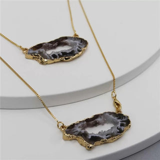 gold plated necklace with two geode stones
